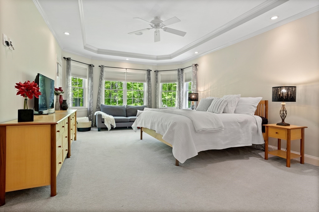 247 Whiley Road Groton, MA 01450 - Photo 15 of 42 a bedroom with a bed and a couch