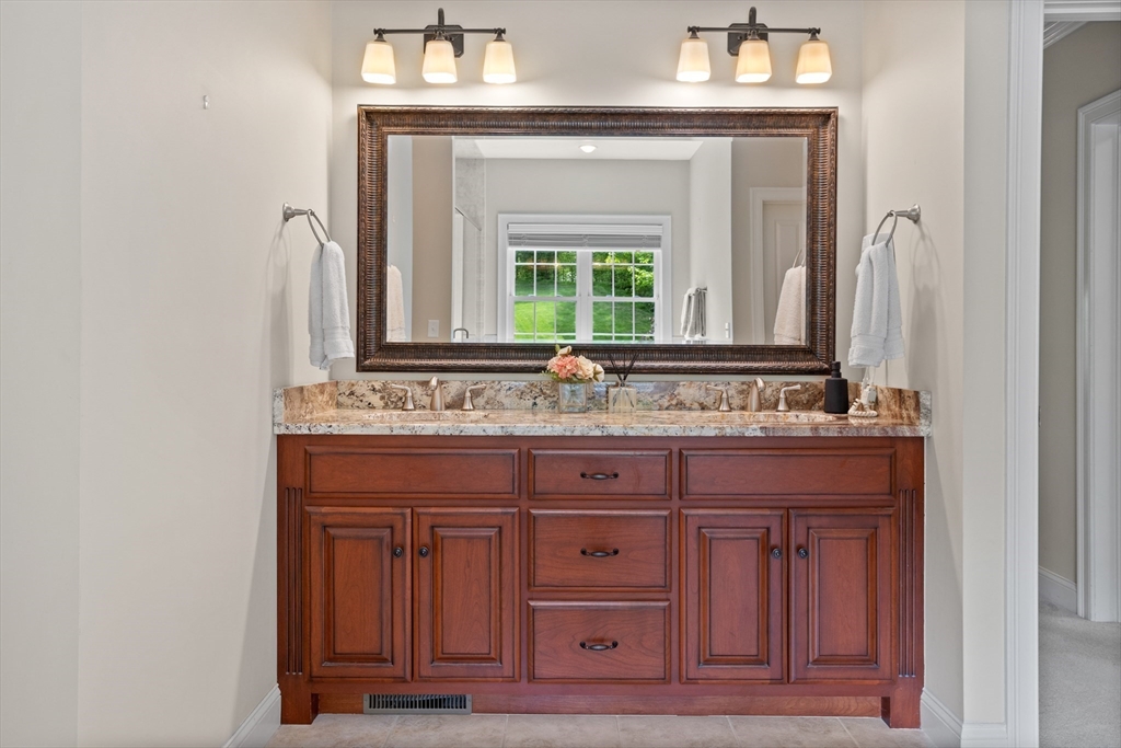 247 Whiley Road Groton, MA 01450 - Photo 18 of 42 a bathroom with a sink and a mirror