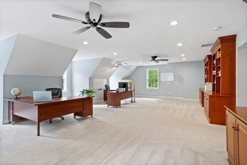 247 Whiley Road Groton, MA 01450 - Photo 24 of 42 a living room with furniture and kitchen view