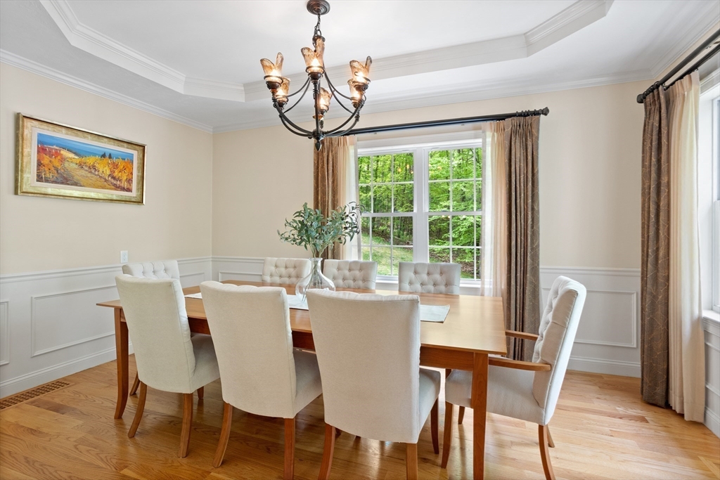 247 Whiley Road Groton, MA 01450 - Photo 9 of 42 a view of a dining room with furniture window and wooden floor