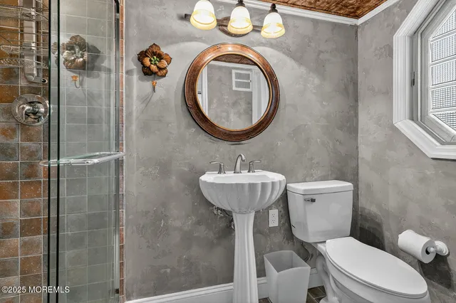 a bathroom with a toilet and a sink