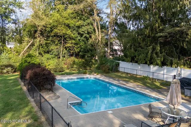 a view of a swimming pool with an outdoor seating