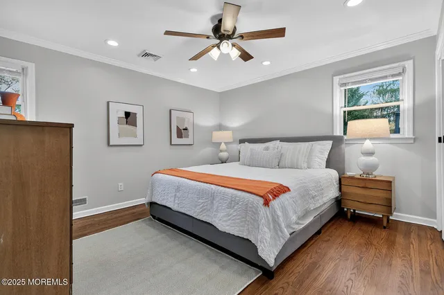 a bedroom with bed and a window