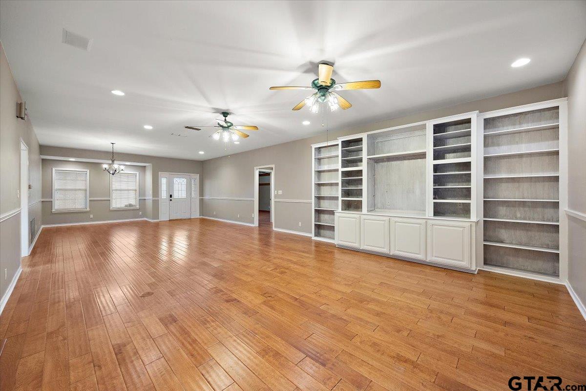 142 Parrish Rusk, TX 75785 - Photo 7 of 43 a view of an empty room with a window and wooden floor