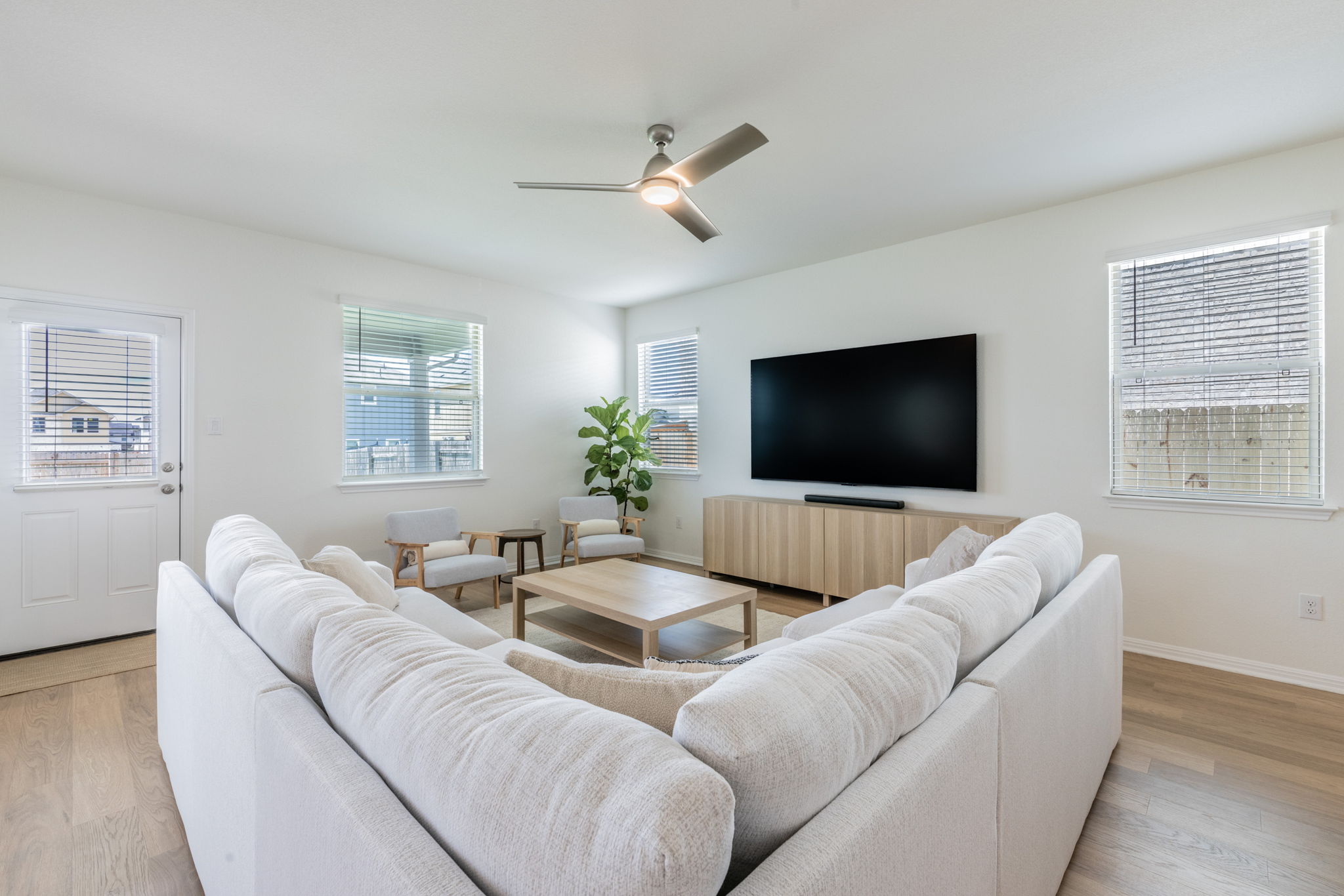 593 Backstays Loop Kyle, TX 78640 - Photo 3 of 26 a living room with furniture and a flat screen tv