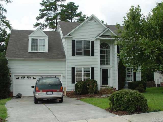 12217 Freemont Lane Raleigh, NC 27613 - Photo 1 of 1 a car parked in front of a house