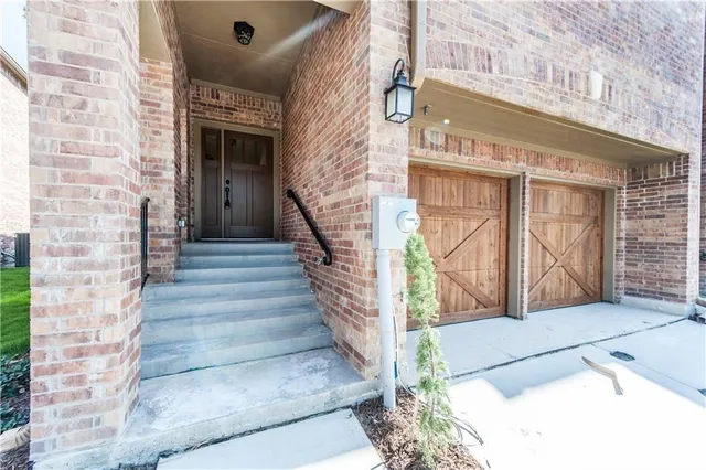 a view of front door of house with stairs