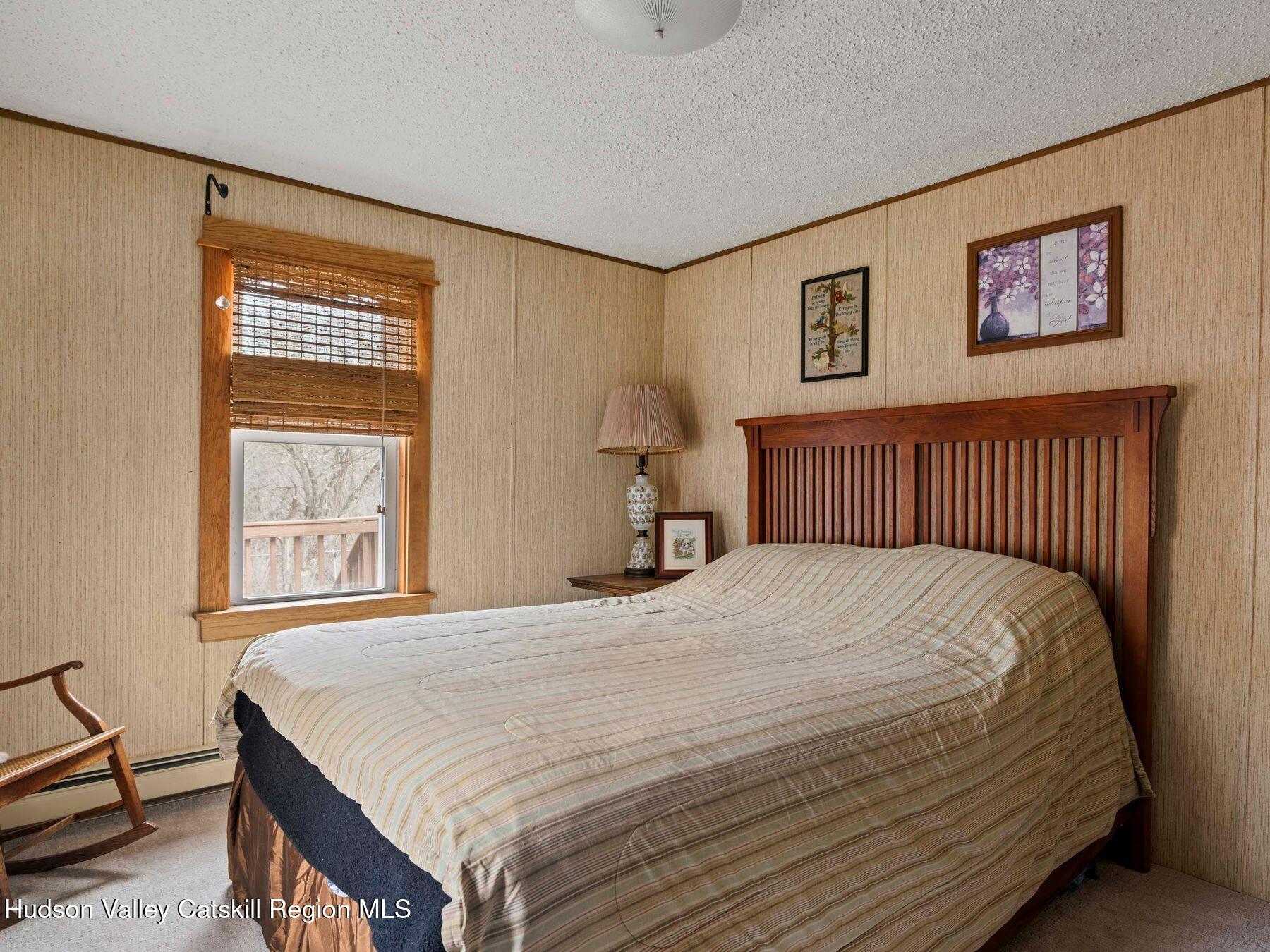 382 Cairo Junction Road Catskill, NY 12414 - Photo 28 of 38 a bedroom with a bed and a window