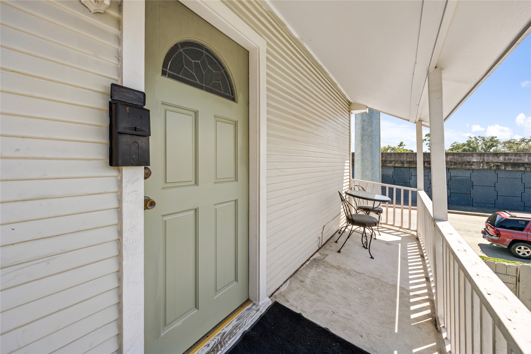 1310 Reid Street, Unit B Houston, TX 77022 - Photo 2 of 13 a view of a balcony with chair and table