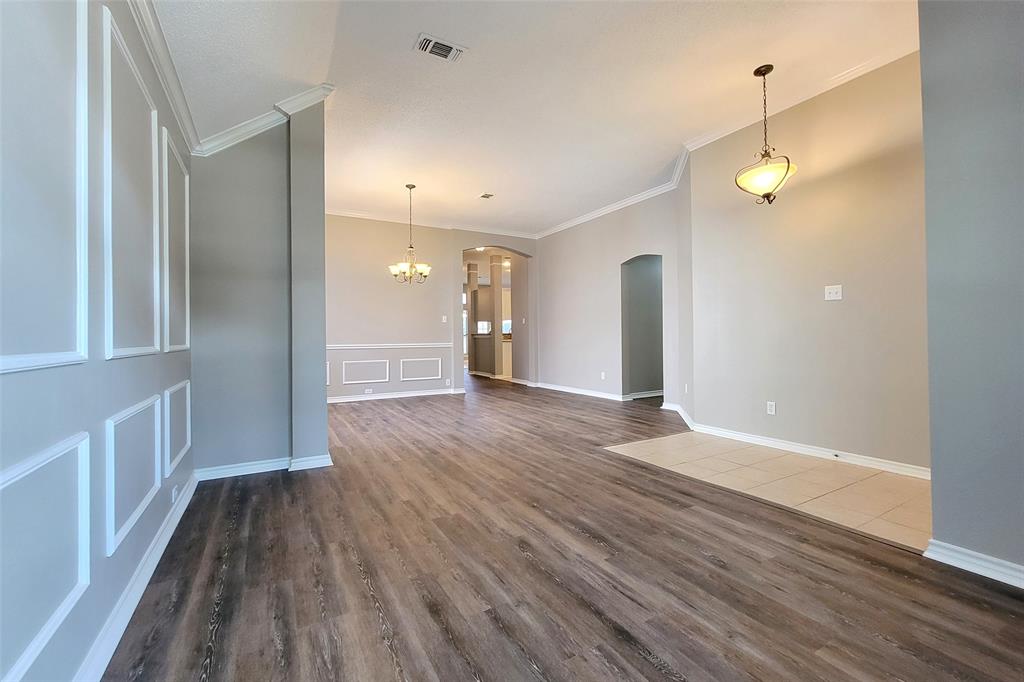 1604 Knoll Ridge Circle Corinth, TX 76210 - Photo 7 of 37 Spacious interior with wood-finish flooring and neutral wall tones