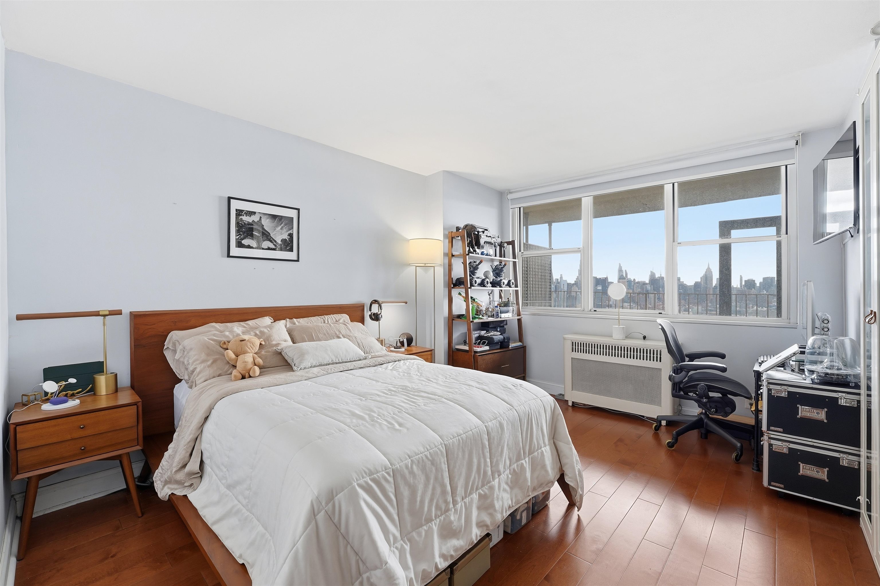 6040 Boulevard East, Unit 32E West New York, NJ 07093 - Photo 12 of 27 a bedroom with a bed and a large window