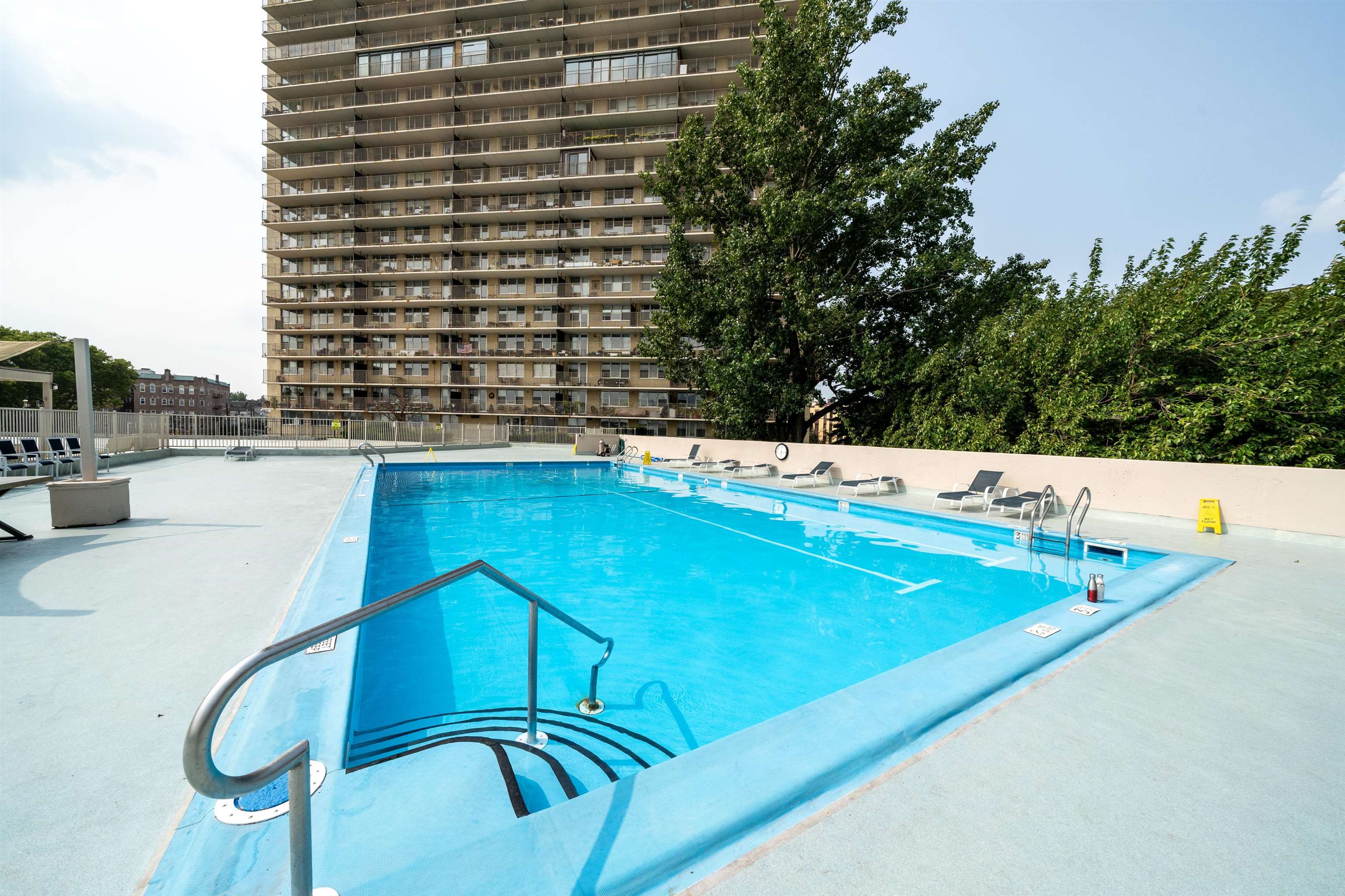 6040 Boulevard East, Unit 32E West New York, NJ 07093 - Photo 23 of 27 a view of swimming pool with chairs