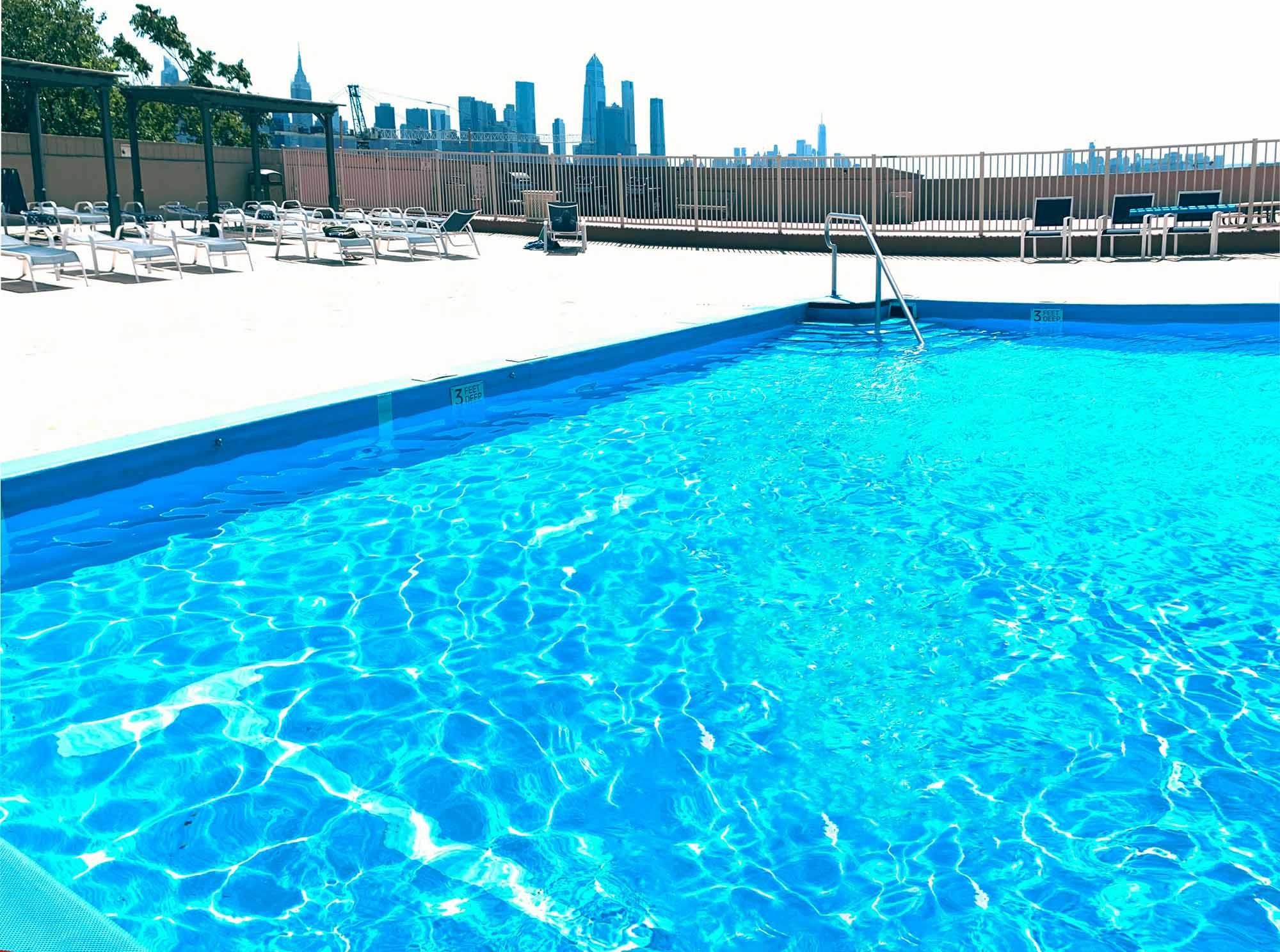 6040 Boulevard East, Unit 32E West New York, NJ 07093 - Photo 24 of 27 a view of a swimming pool with an outdoor space