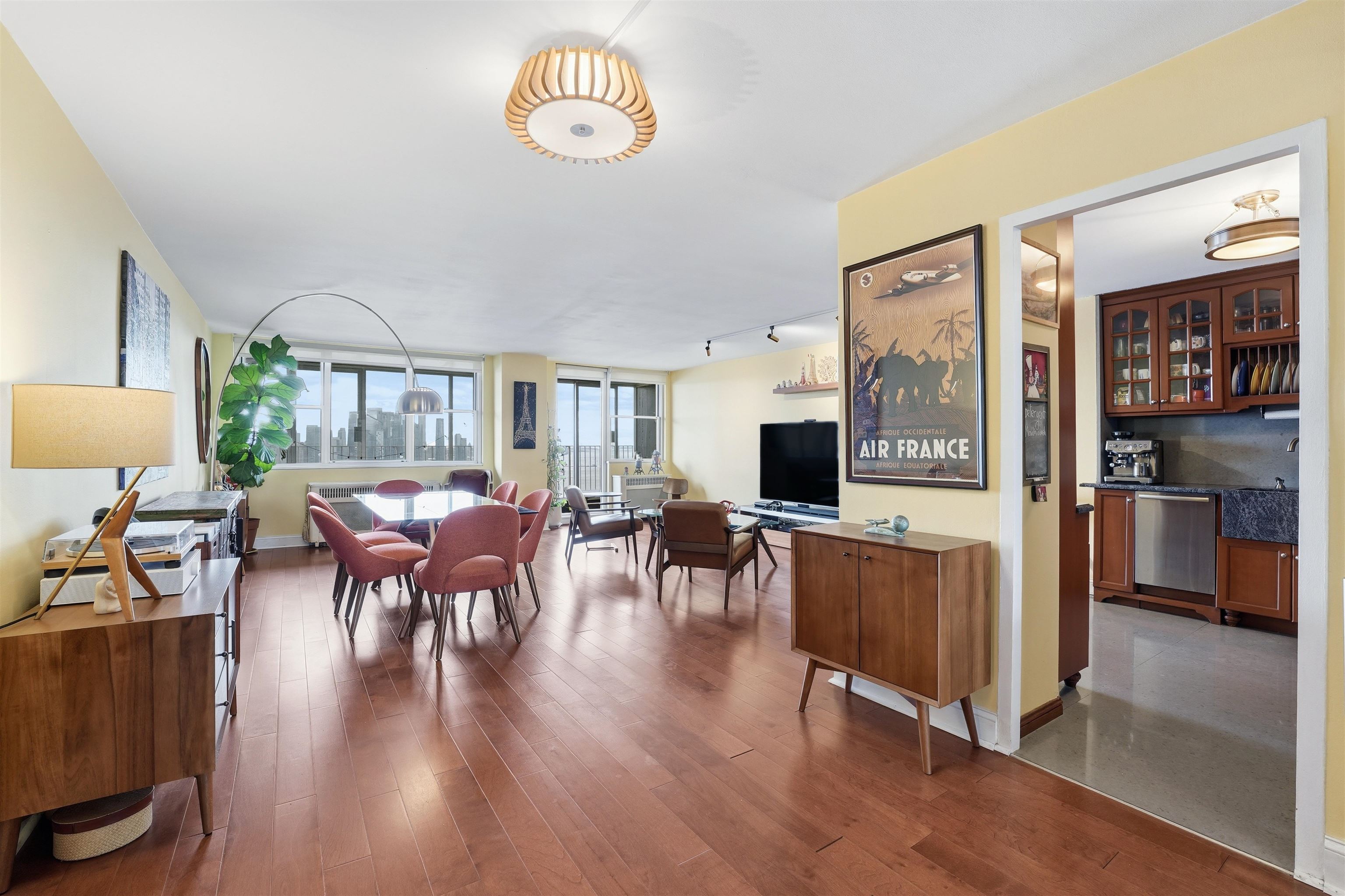 6040 Boulevard East, Unit 32E West New York, NJ 07093 - Photo 7 of 27 a view of a dining room with furniture window and wooden floor
