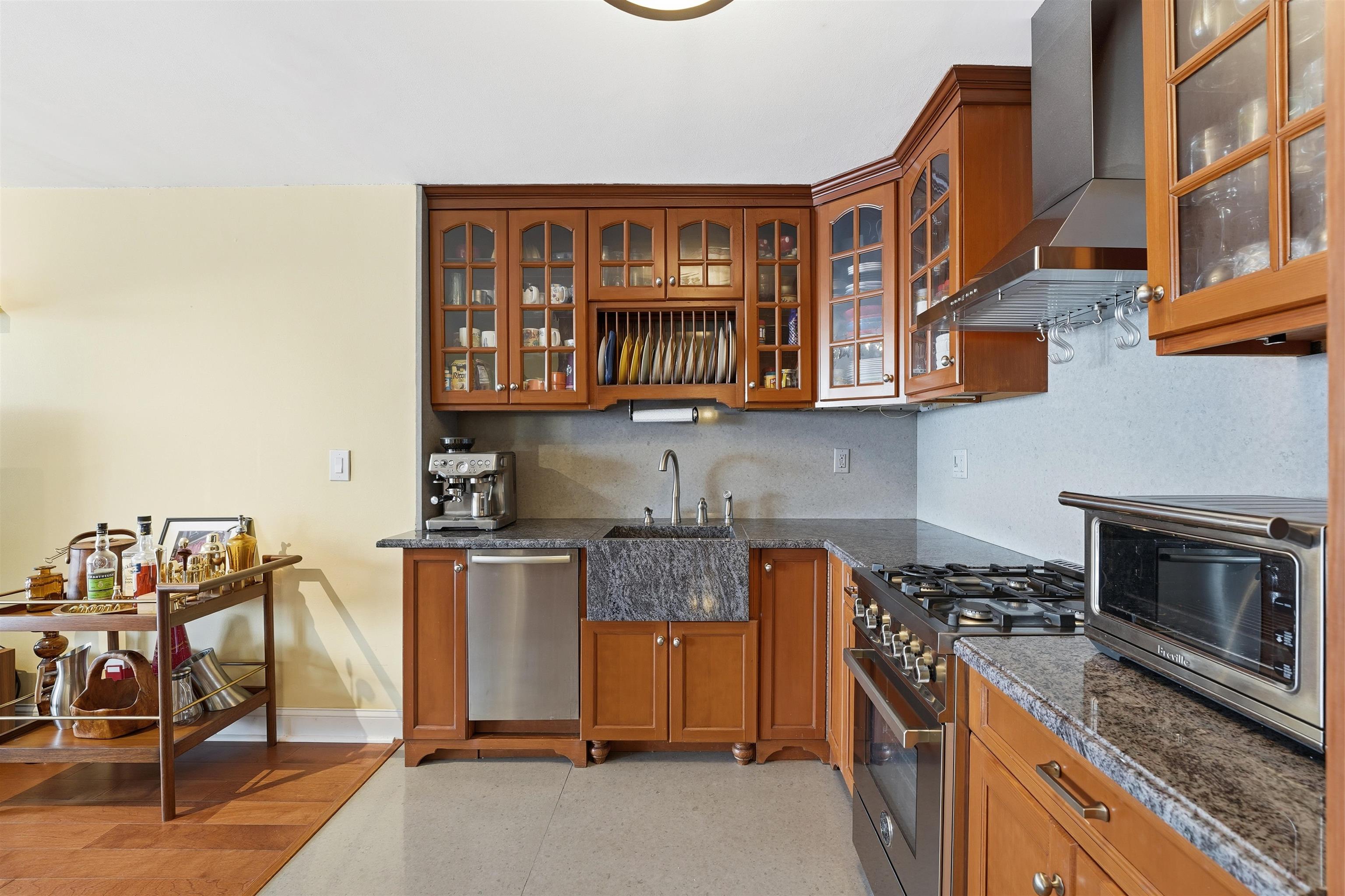 6040 Boulevard East, Unit 32E West New York, NJ 07093 - Photo 9 of 27 a kitchen with stainless steel appliances granite countertop a stove and a sink