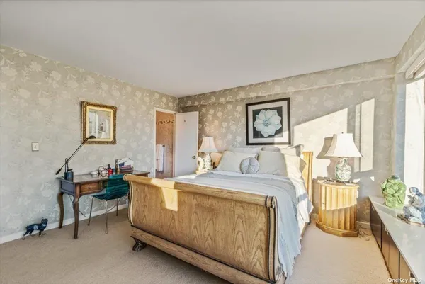 a bed room with a bed and a table