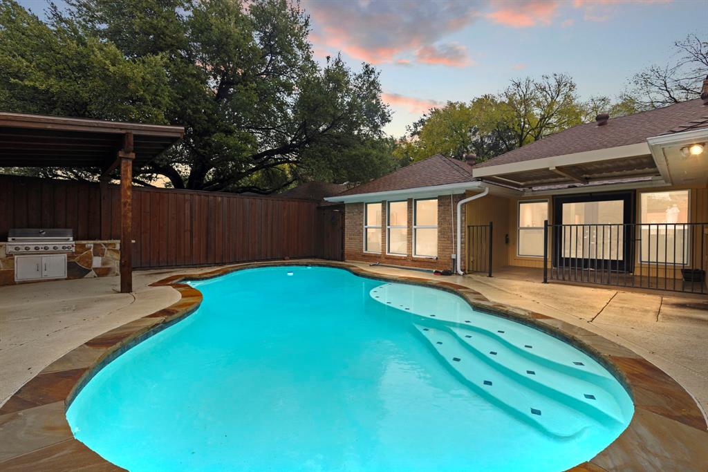a view of a backyard with a patio and wooden floor