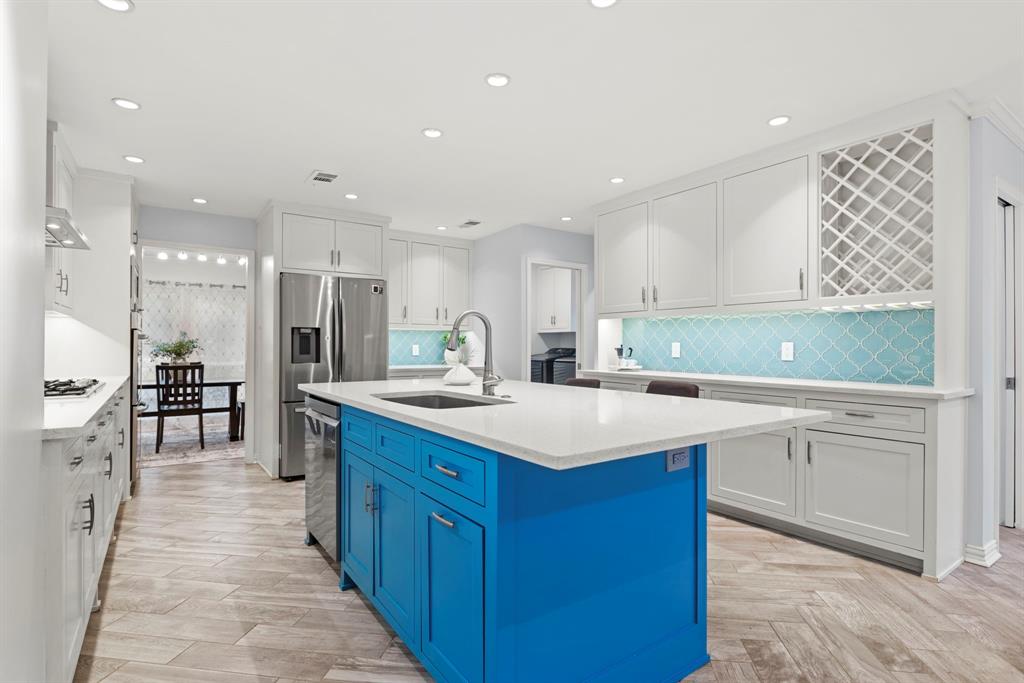 16707 Rustic Meadows Drive Dallas, TX 75248 - Photo 11 of 33 a kitchen with a sink appliances and cabinets