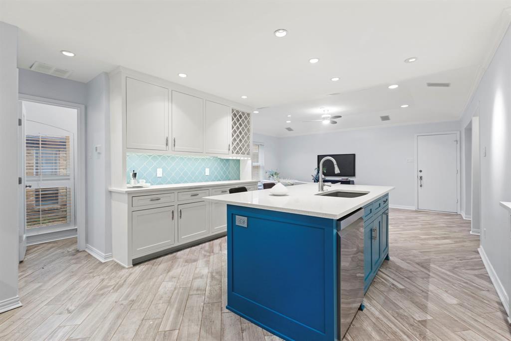 16707 Rustic Meadows Drive Dallas, TX 75248 - Photo 12 of 33 a kitchen with a sink and cabinets
