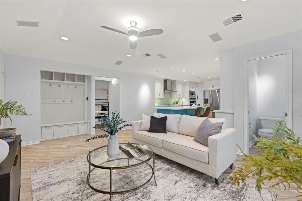 16707 Rustic Meadows Drive Dallas, TX 75248 - Photo 13 of 33 a living room with furniture and a potted plant