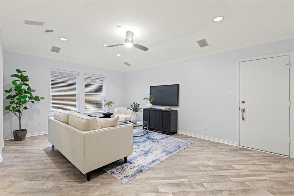16707 Rustic Meadows Drive Dallas, TX 75248 - Photo 14 of 33 a living room with furniture and a flat screen tv