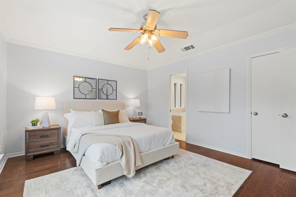 16707 Rustic Meadows Drive Dallas, TX 75248 - Photo 19 of 33 a bedroom with a bed and a painting on the wall