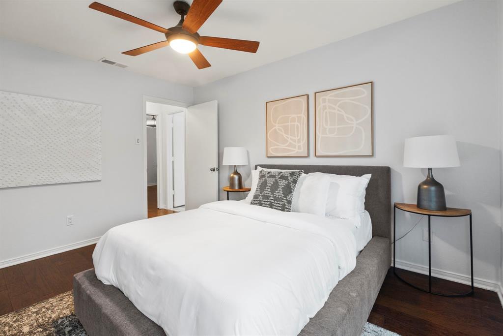 16707 Rustic Meadows Drive Dallas, TX 75248 - Photo 24 of 33 a bedroom with a bed and a lamp