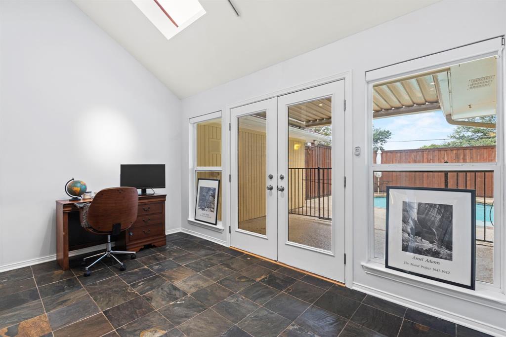 16707 Rustic Meadows Drive Dallas, TX 75248 - Photo 27 of 33 a workspace with furniture and a fireplace