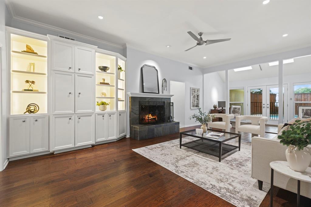16707 Rustic Meadows Drive Dallas, TX 75248 - Photo 3 of 33 a living room with furniture wooden floor and a fireplace