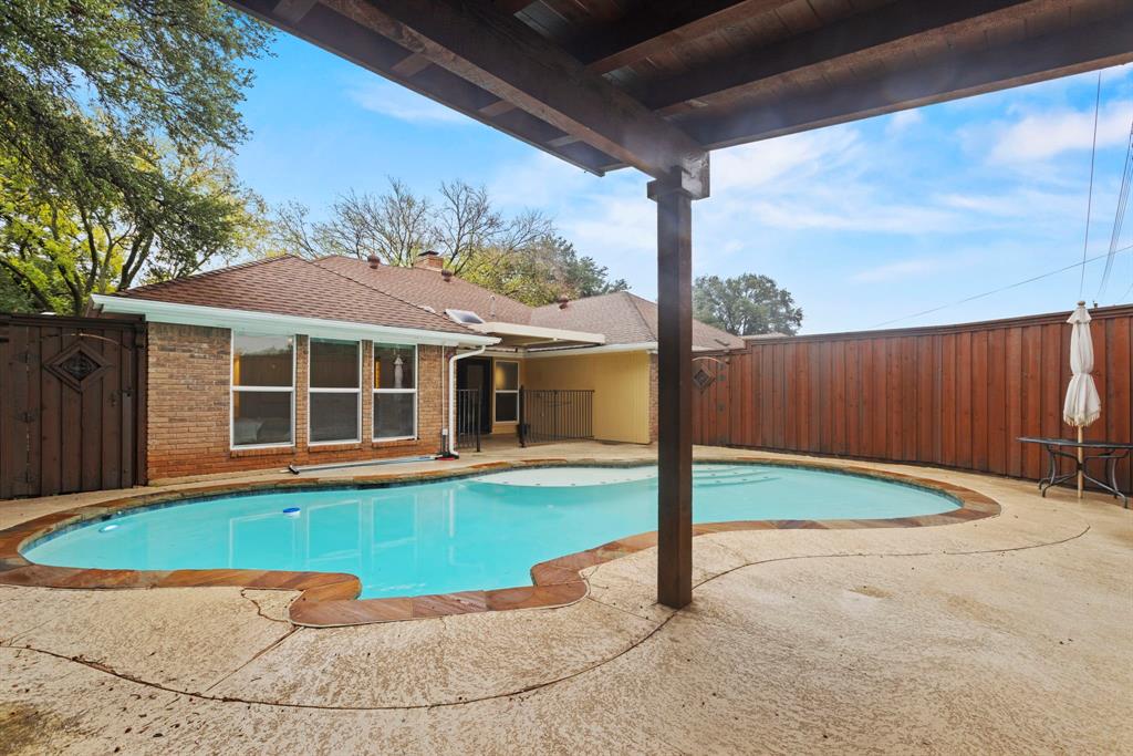 16707 Rustic Meadows Drive Dallas, TX 75248 - Photo 31 of 33 a view of a house with backyard and porch