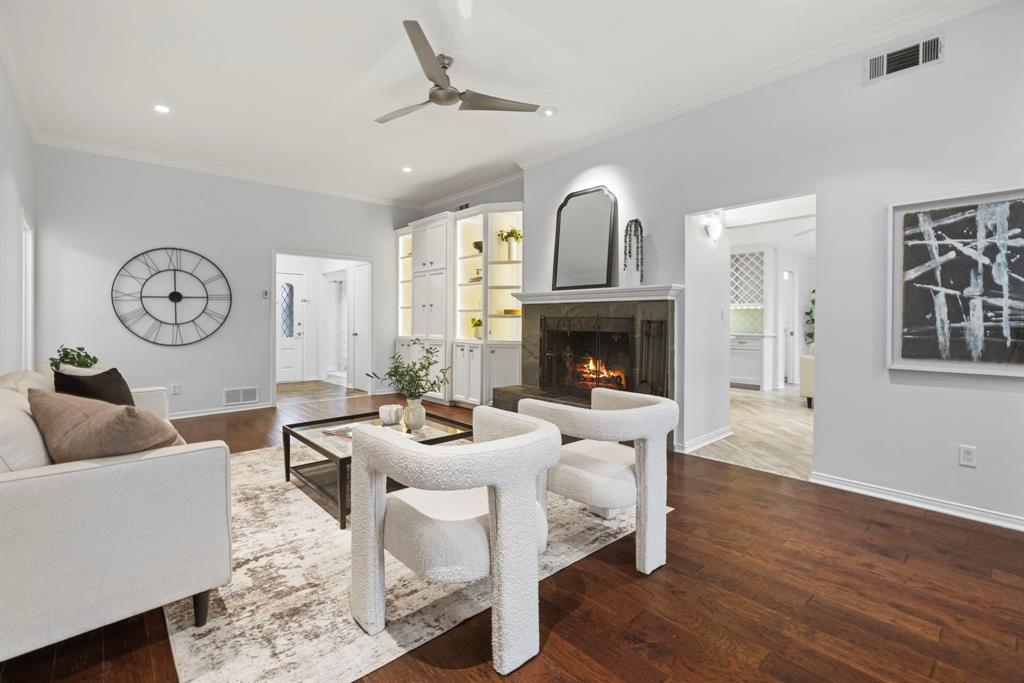 16707 Rustic Meadows Drive Dallas, TX 75248 - Photo 4 of 33 a living room with furniture a fireplace and a window