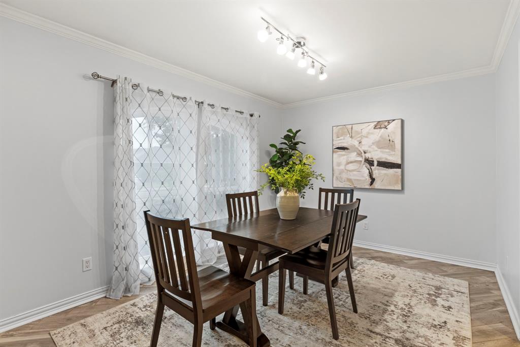 16707 Rustic Meadows Drive Dallas, TX 75248 - Photo 8 of 33 a view of a dining room with furniture and chandelier