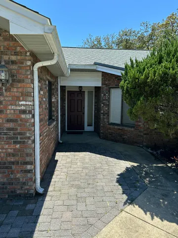 a view of a entryway door with an outdoor space