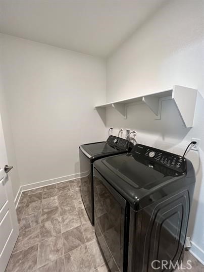 24800 Cimarron Circle Menifee, CA 92584 - Photo 18 of 29 a utility room with dryer and washer