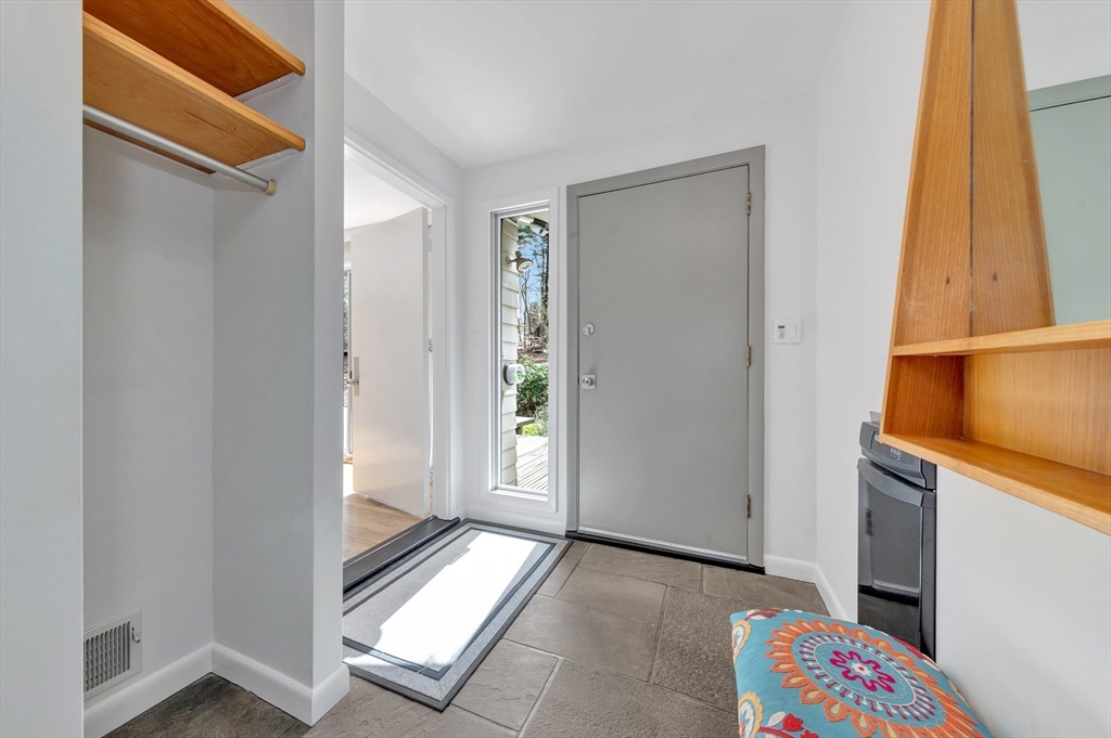 85 The Valley Road Concord, MA 01742 - Photo 2 of 38 a view of front door with wooden floor