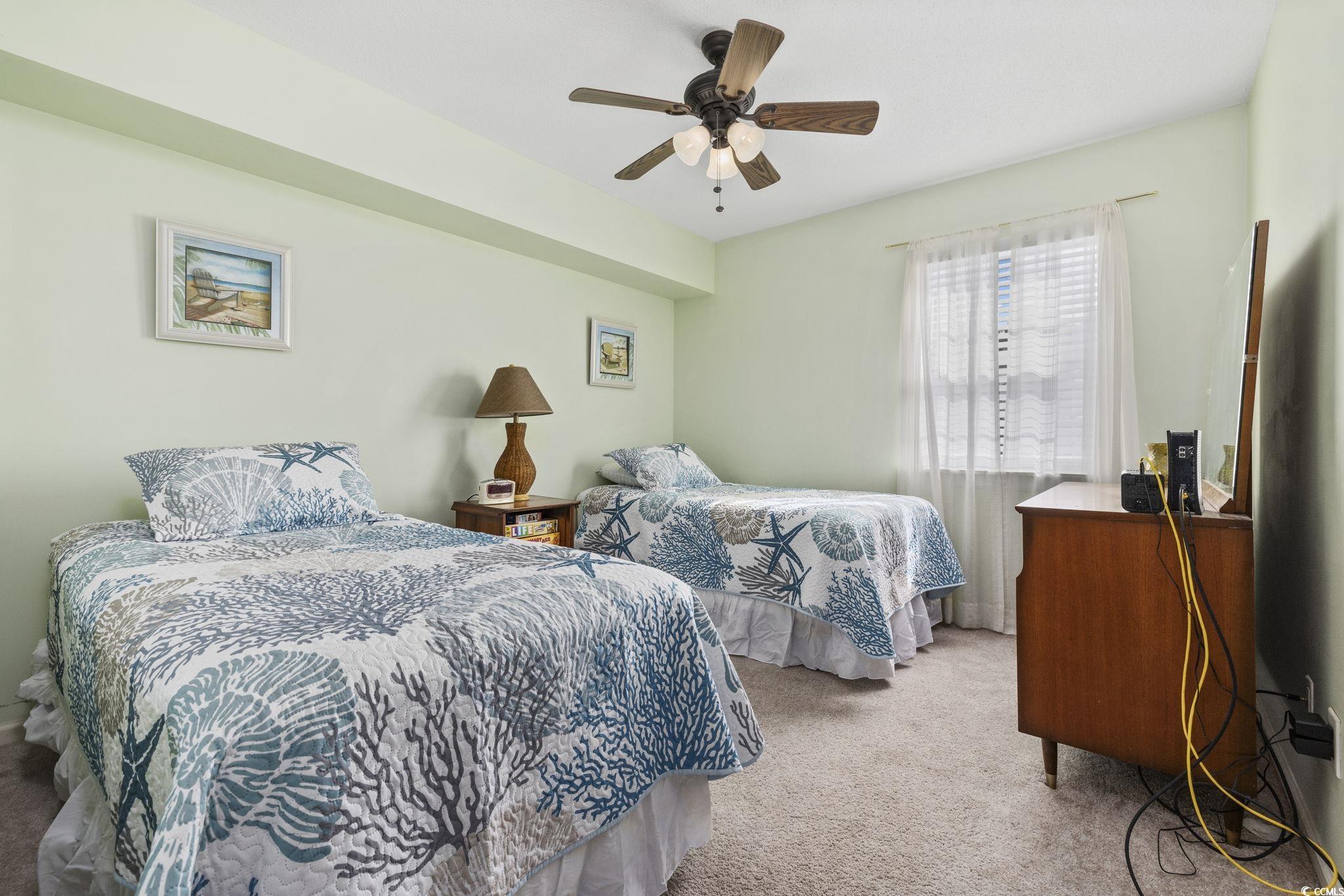 1356 Glenns Bay Road, Unit E 204 Surfside Beach, SC 29575 - Photo 13 of 27 Carpeted bedroom featuring ceiling fan
