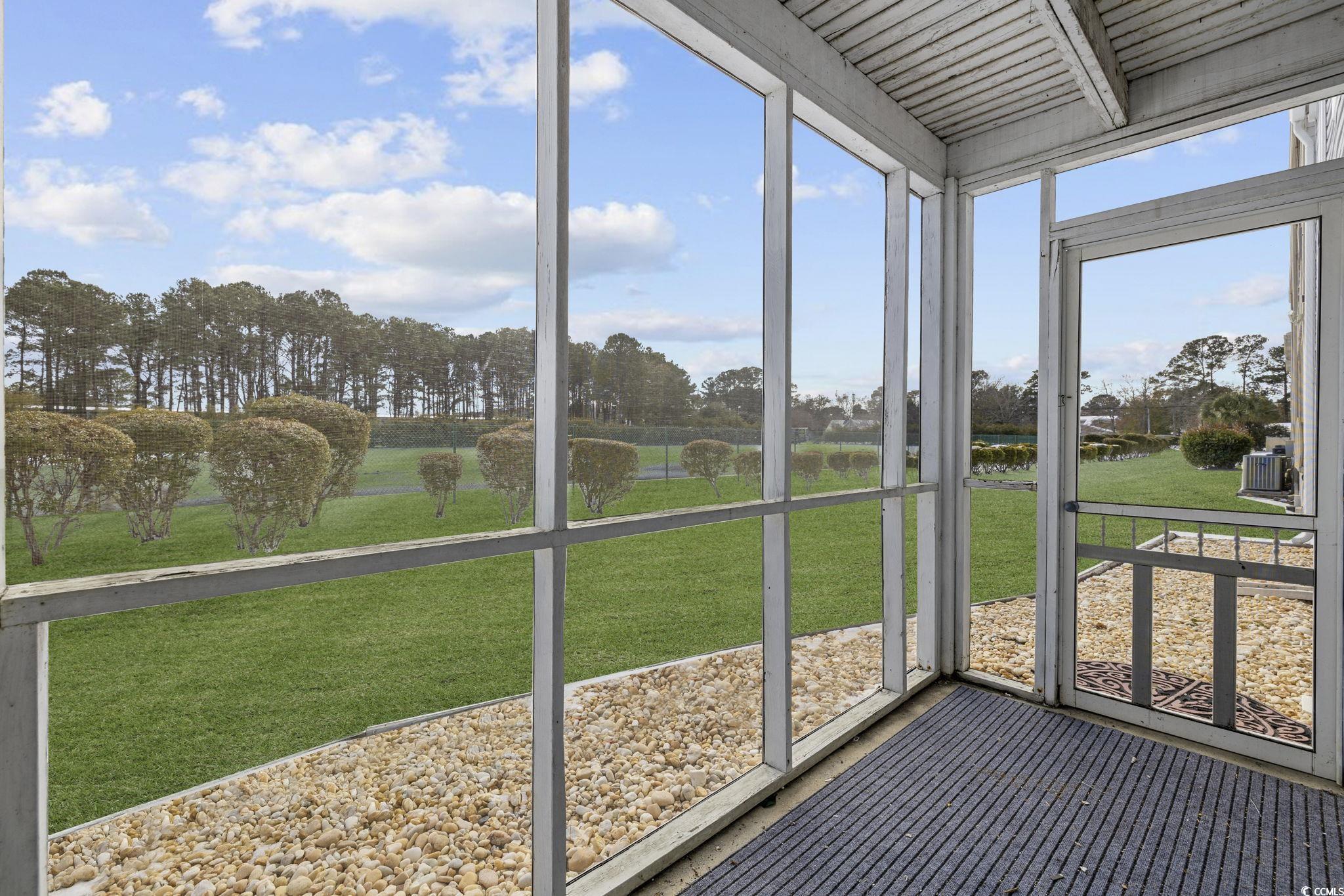 1356 Glenns Bay Road, Unit E 204 Surfside Beach, SC 29575 - Photo 20 of 27 Unfurnished sunroom with plenty of natural light
