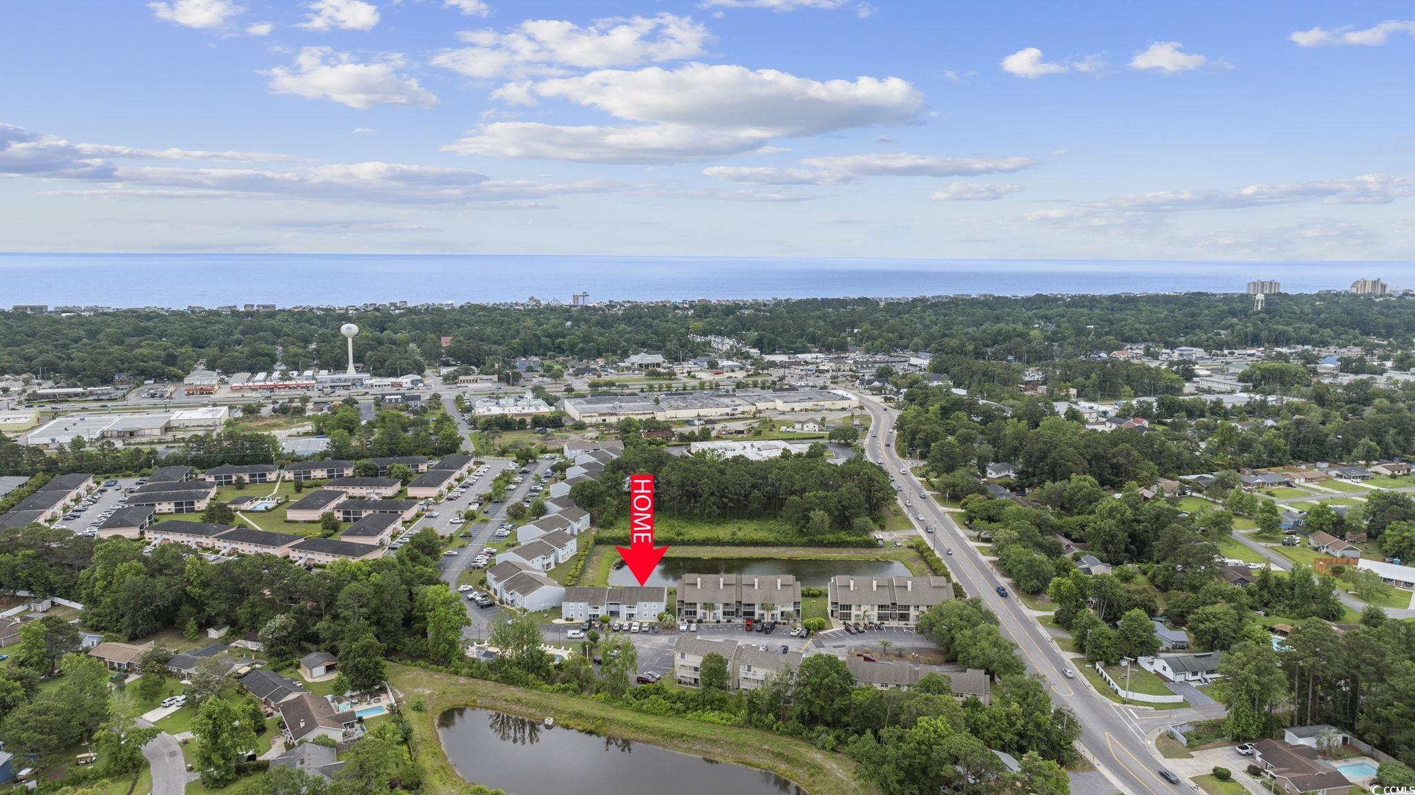 1356 Glenns Bay Road, Unit E 204 Surfside Beach, SC 29575 - Photo 22 of 27 Drone / aerial view featuring a water view