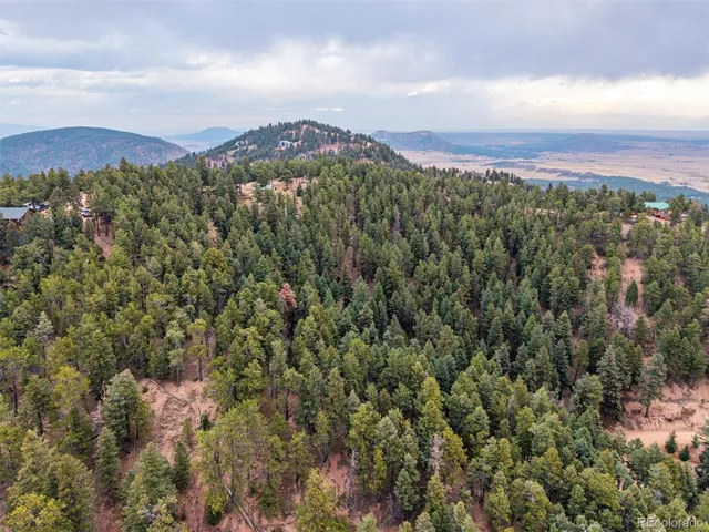a view of a city with mountains in the background