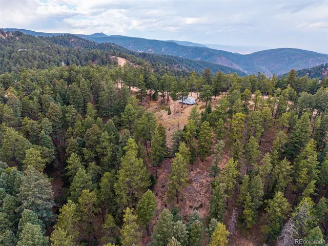 an aerial view of residential house and green space