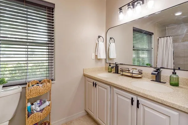 a bathroom with a sink a vanity and a mirror