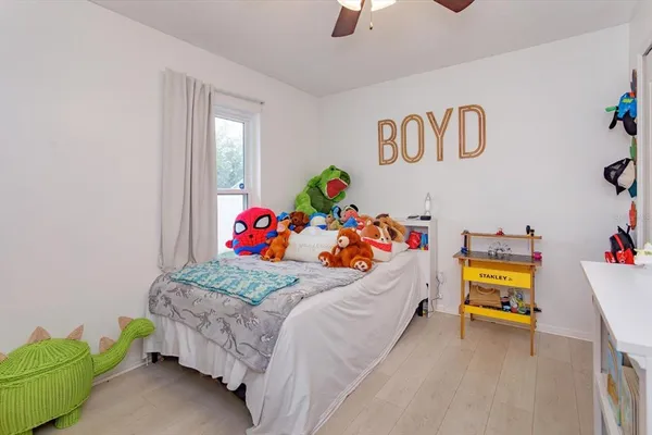 a bedroom with a bed and a baby couch