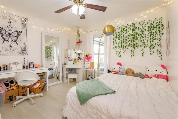 a bedroom with furniture and windows