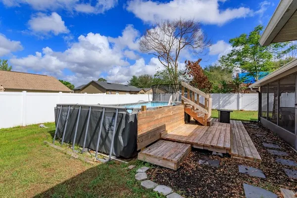 a view of a backyard with sitting area