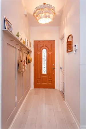 a view of a room with wooden floor and cabinet