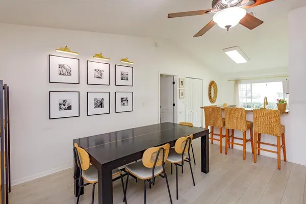a view of a dining room with furniture and wooden floor