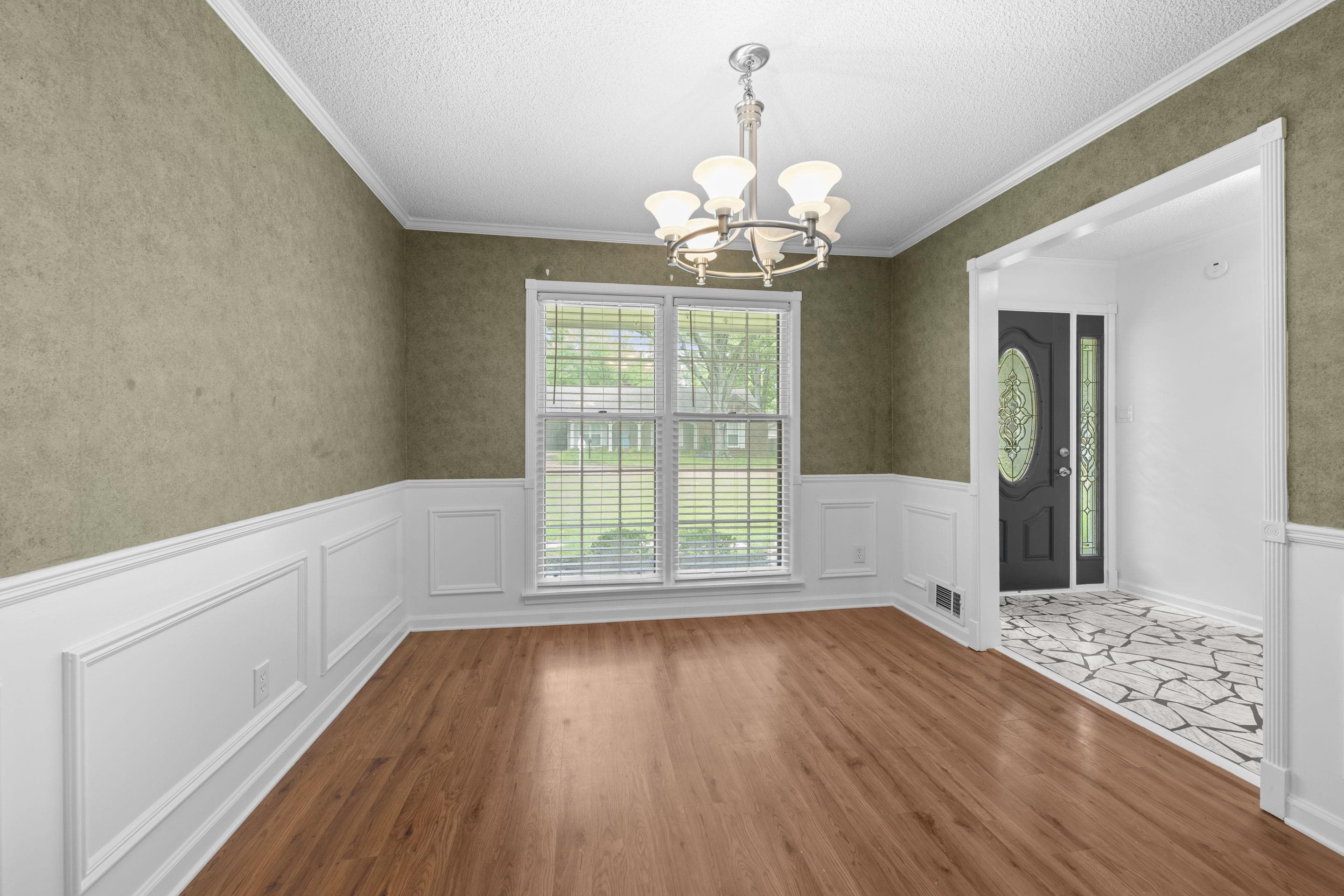 499 Duscoe Street Collierville, TN 38017 - Photo 15 of 38 a view of livingroom with chandelier and wooden floor