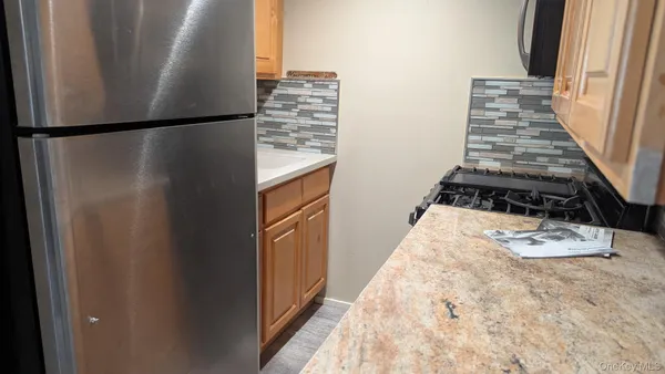 a view of a closet with wooden floor