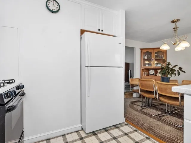 a white refrigerator freezer sitting inside of a kitchen