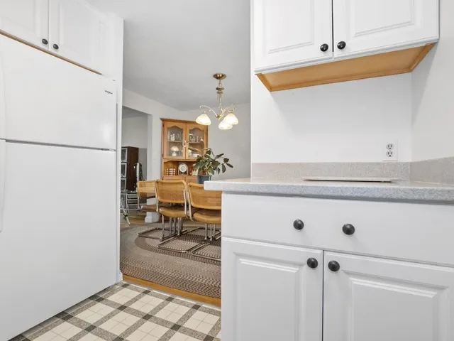 a view of living room with furniture and a table